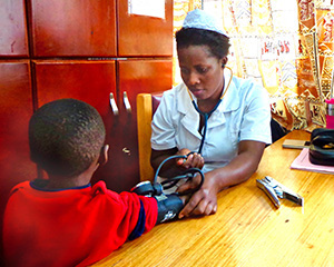 An image of a clinical trial participant and a nurse.