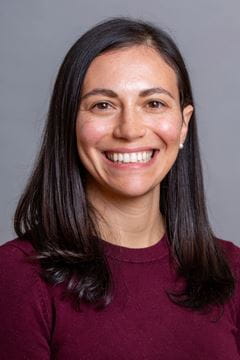 A photo of Rebecca Caine.
