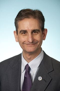 A photo of Louis Muglia.