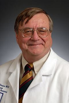 A photo of Dr. Arnold Strauss.