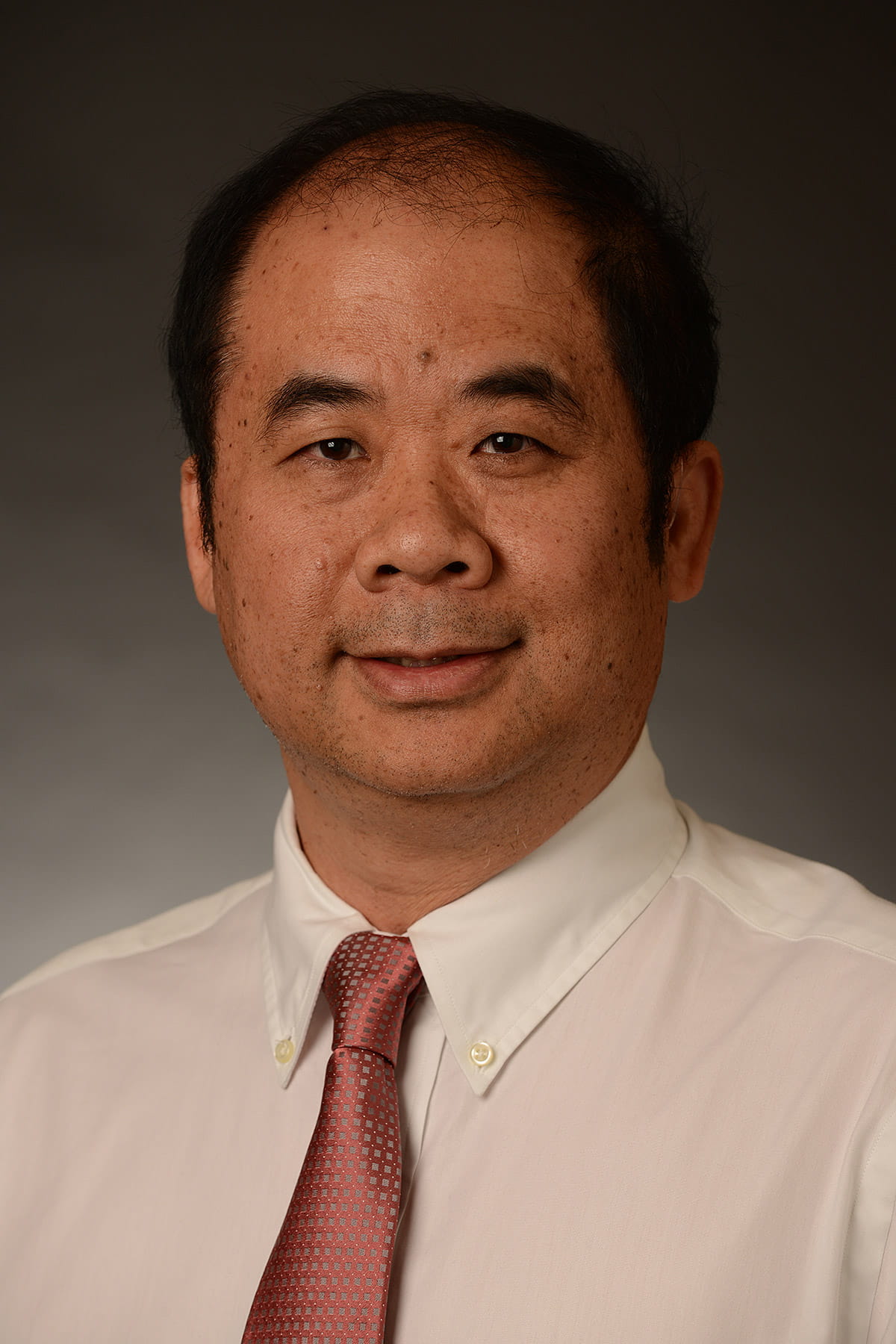 A photo of Ming Tan.