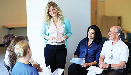 Annie Schneider prepares reading tutors.