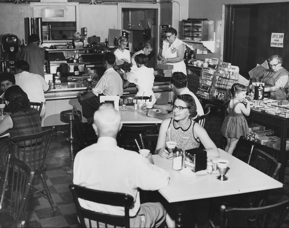 Staff and visitors take a break in the coffee shop, aka the Rainbow Room.