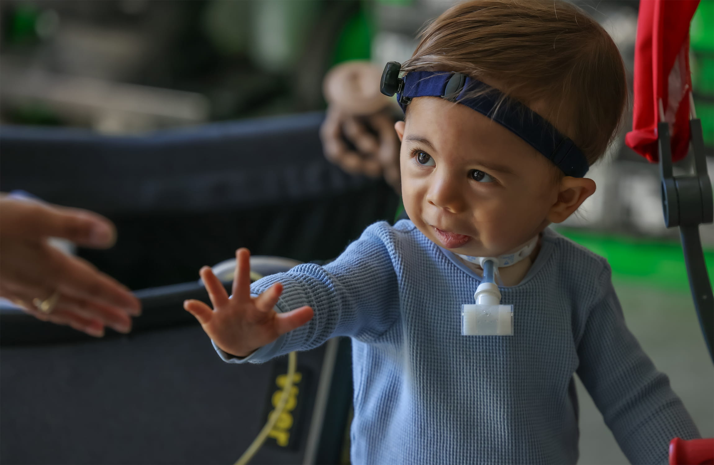 Rami holds his hand up.