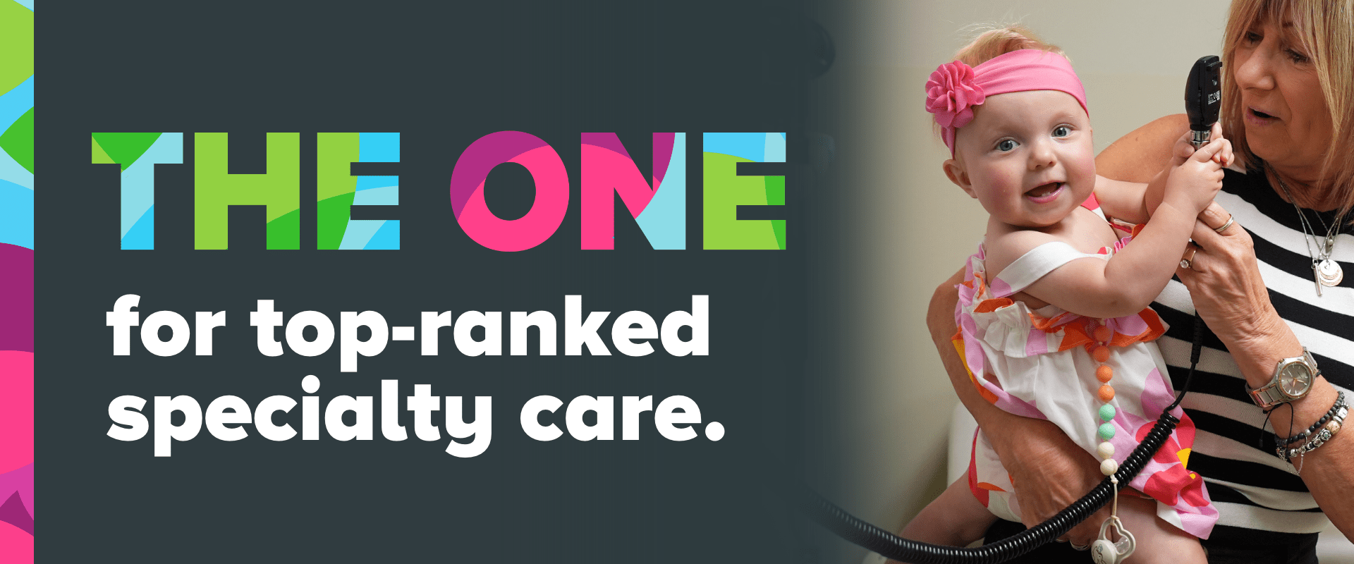 A little girl smiles for the camera while holding a stethoscope. 