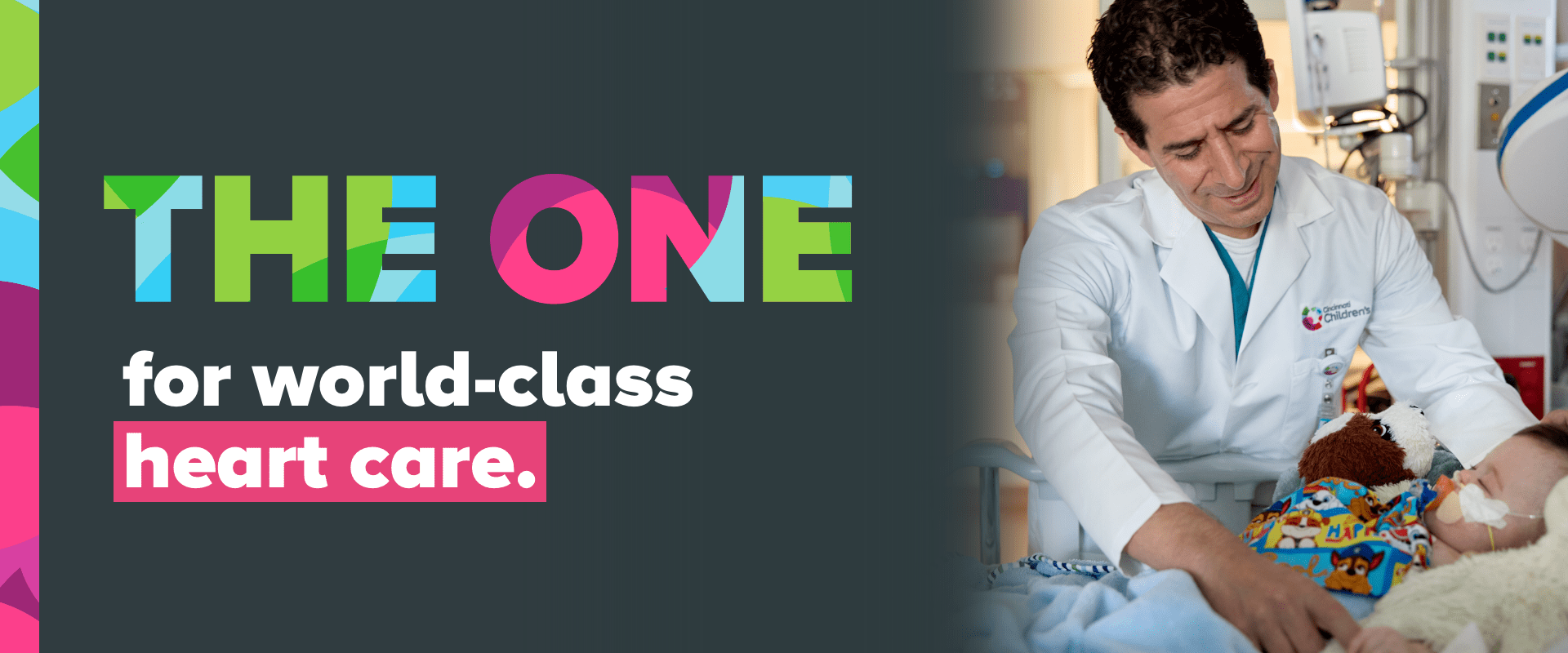 A doctor smiles while with a patient.