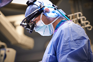 A photo of Francesco Mangano, DO, performing neurosurgery.