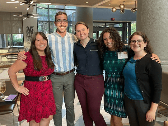 A group of Clinical Pharmacology Fellowship alumni standing together.