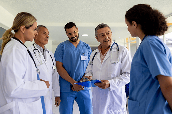 Medical students gathered in a hallway.