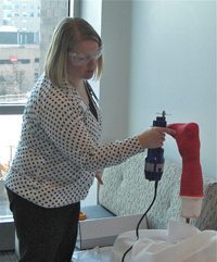 Physical therapist, Molly Thomas, demonstrating cast removal