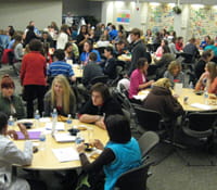 Students participating in round table discussions with the experts during the luncheon.