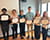 Members of the high school internship group with their certificates.