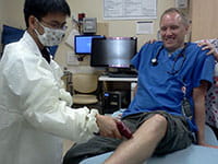 high school summer-slideshow-Derek-Shu-treating-Dr-Timm-200_jpg