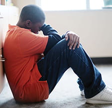 Image of a depressed teenager.