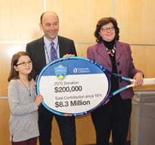 Cincinnati Children's CEO Michael Fisher accepts donation.