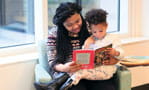 Mom reading to her child.