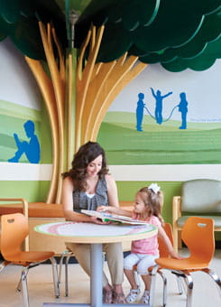 Mom reads with her child.