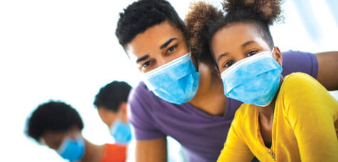 Teens wearing masks.