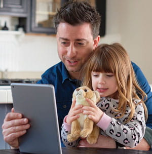 Father and daughter during Telehealth visit.