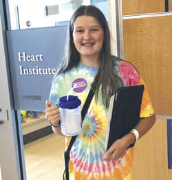 Hope smiles outside the Heart Institute.