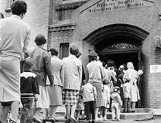 Children and families lined up for the new oral polio vaccine.