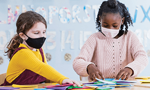 Girls work together on project.