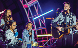Andy Grammer performs with fans.