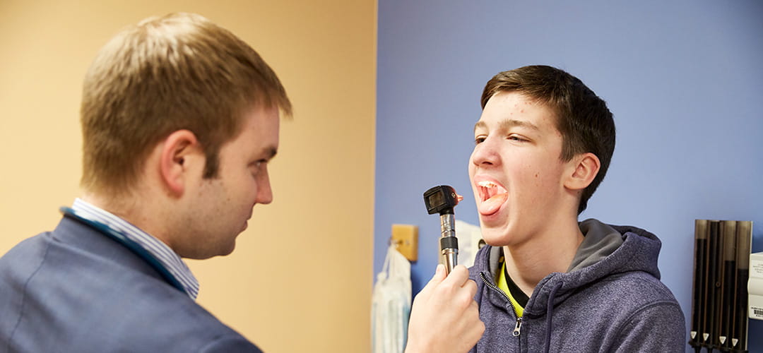 A photo of a boy patient at a health exam.