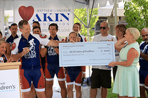 Justin Akin presents $200,000 check to Cincinnati Children’s.