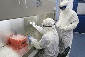 A photo of technicians working in a laboratory.