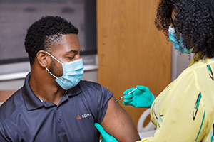 An image of a person receiving a vaccine.
