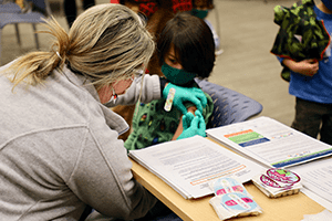 An image of a child getting his COVID vaccine.