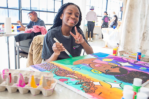 A photo of a girl painting.