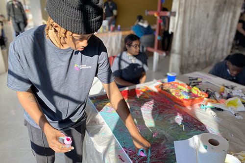 A photo of a boy painting.