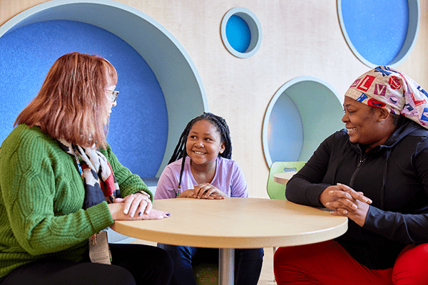 A patient and family meeting with a provider.