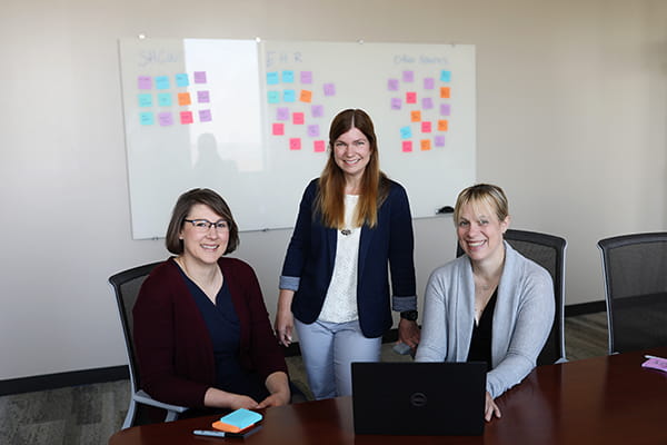 A photo of Cincinnati Children’s researchers (from left) Sarah Beal, PhD, Mary Greiner, MD, and Judith Dexheimer, PhD, who developed IDENTITY software to improve outcomes for kids in foster care.
