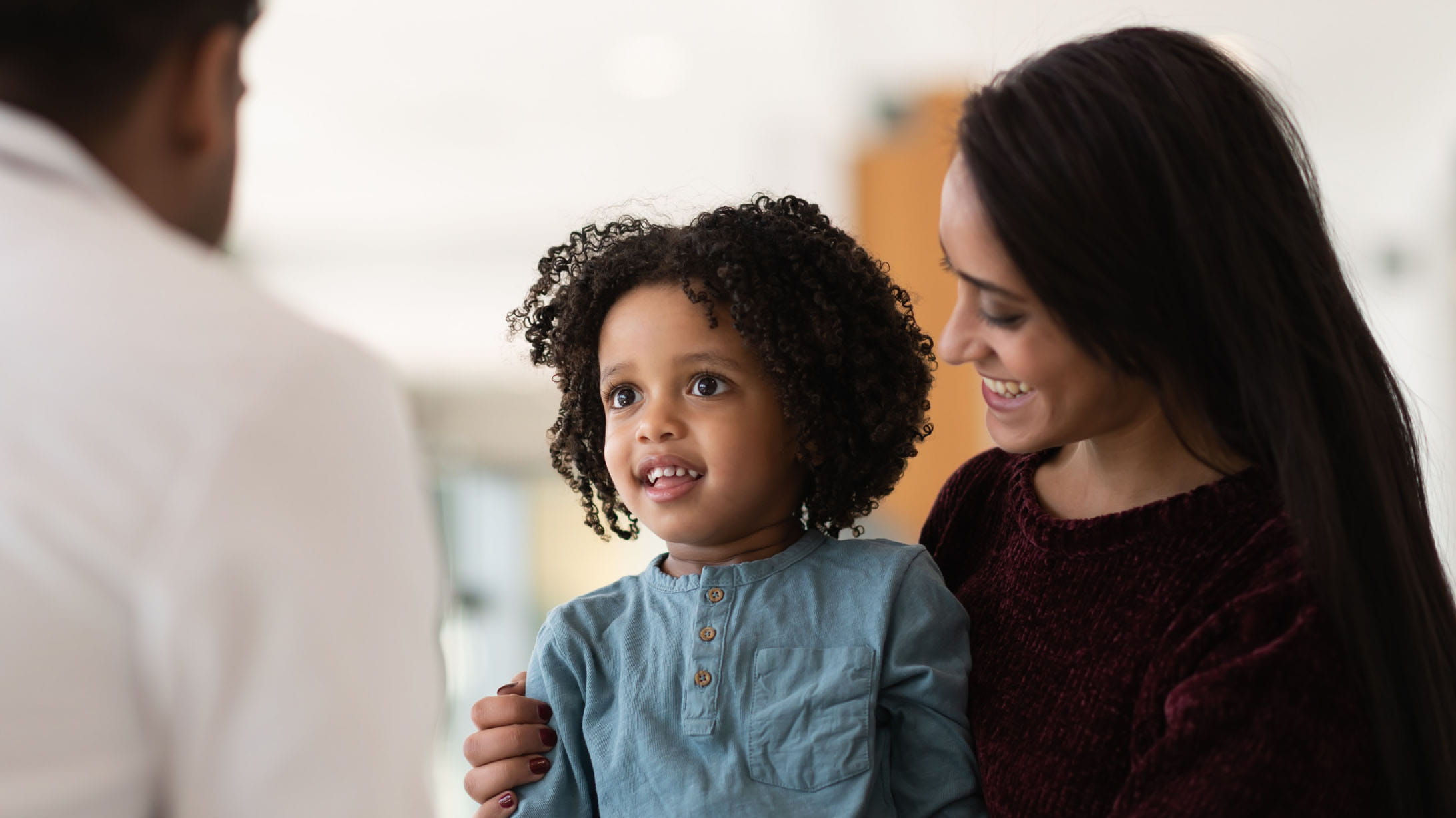 girl and mom with pediatrician
