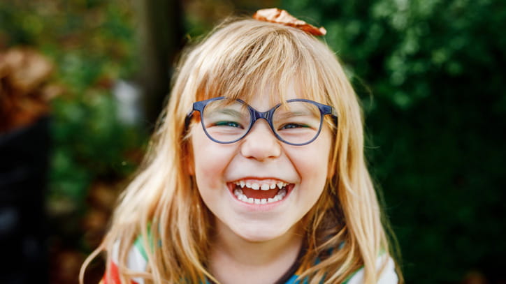 girl glasses big smile