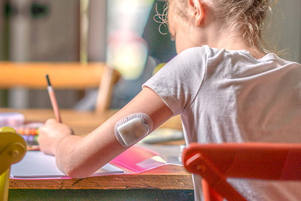 Photo of a child wearing an insulin pump.
