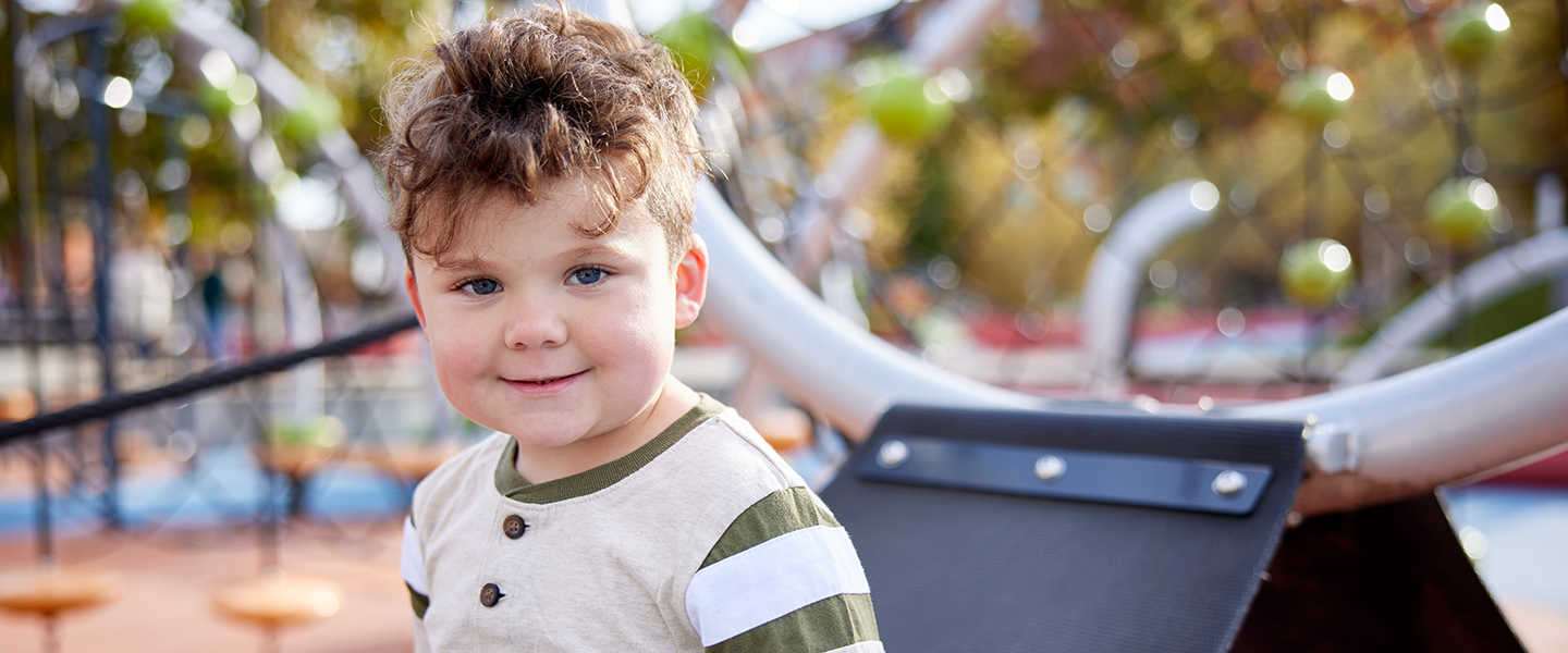 A child playing at a playground.