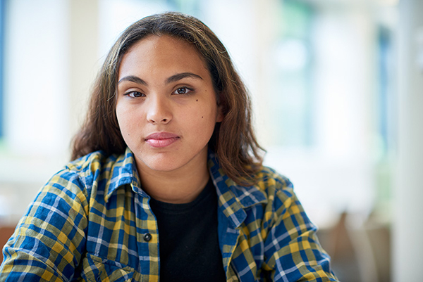 A photo of an adolescent girl smiling.