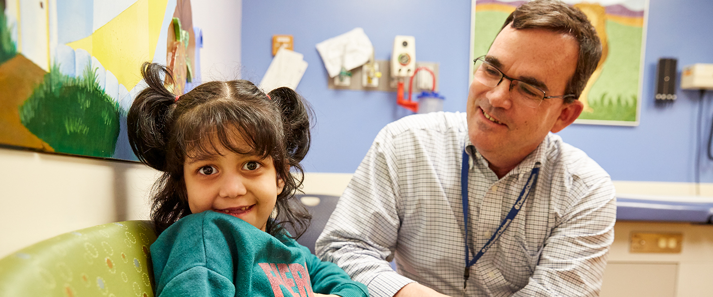 A photo of a doctor with a patient.