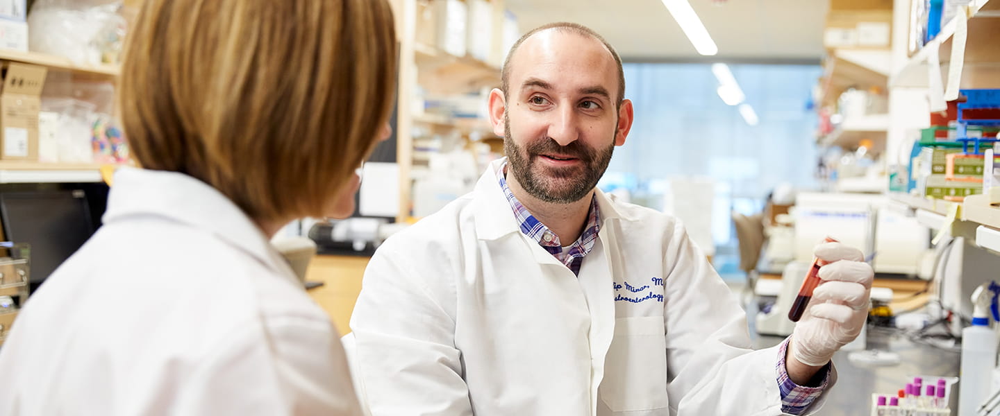 Phillip Minar, MD collaborating with research assistant in Gastroenterology Research Lab.