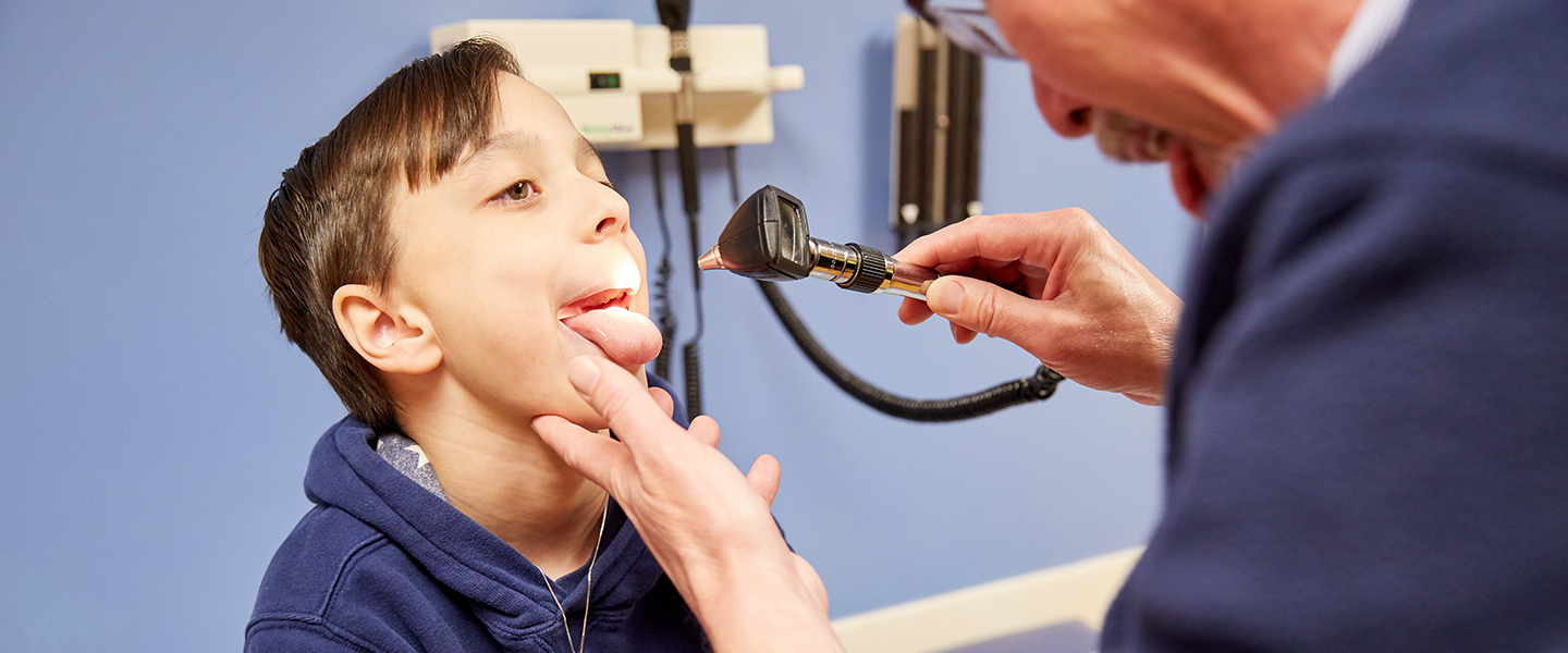 A photo of a doctor examining a patient.