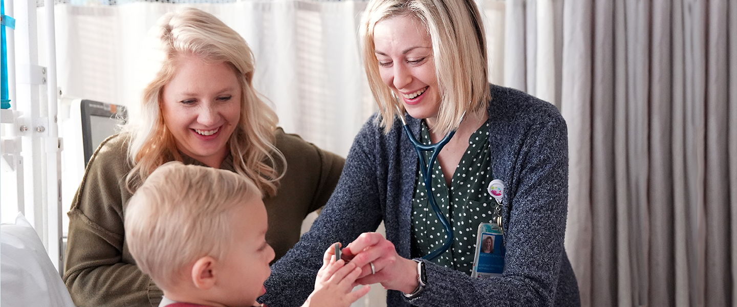 Doctor and her patient smiling in clinic.