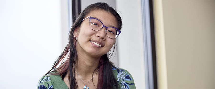 A young patient smiling at the camera.