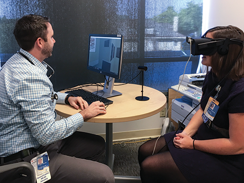 In the photo, Joe Real conducts a VR experience for one of the Cincinnati Children’s residents involved in the study.