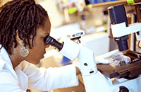 A photo of a researcher using a microscope.