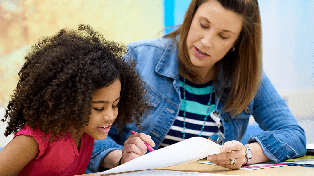 A provider talking with a young girl.