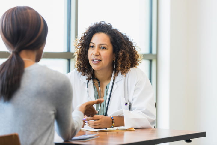 An image of a doctor talking to a patient.